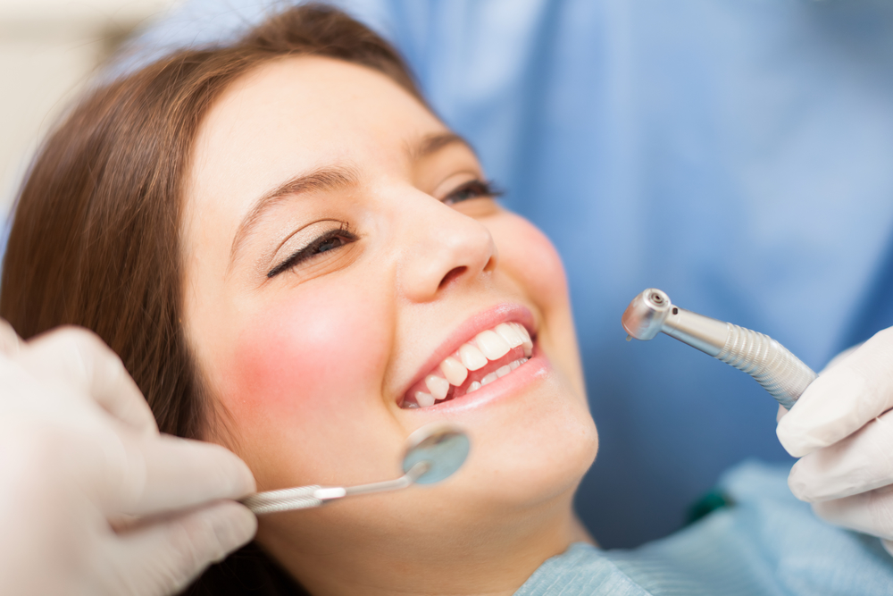 Woman receiving a dental treatment